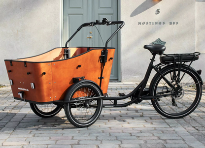 Shot of the Amcargobike Ultimate Harmony cargo bike in an urban setting. 