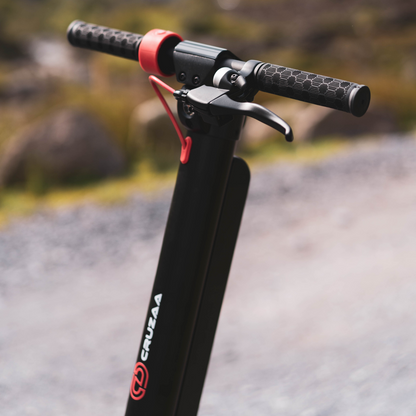 The Commuta Scooter - A detailed shot of the handle bars, in a scenic setting.